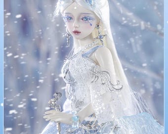 May include: A white porcelain doll with long white hair and blue eyes, wearing a white and blue dress with silver accents. The doll is holding a silver wand and is surrounded by a snowy background. The doll is labeled "Uriel" and "1/4 Bjd Doll".