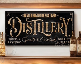May include: A rectangular black sign with gold lettering that reads THE MILLERS DISTILLERY, TOURS & TASTINGS, SPIRITS & COCKTAILS, BOTTLES & BLENDS. The sign features decorative flourishes and is displayed on a wall above a wooden counter with bottles.