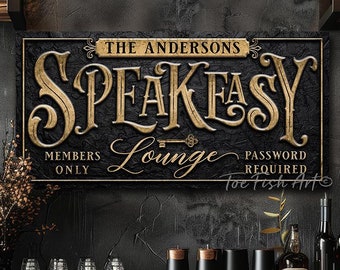 May include: A rectangular wall sign with a black textured background and gold lettering. The text reads THE ANDERSONS SPEAKEASY LOUNGE, MEMBERS ONLY, and PASSWORD REQUIRED. A gold key icon is centered below the word SPEAKEASY.