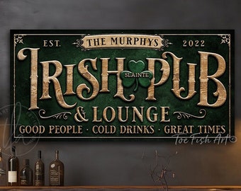 May include: A rectangular wall sign with a dark green textured background featuring the text "EST. THE MURPHYS 2022", "IRISH PUB & LOUNGE", "SLÁINTE", and "GOOD PEOPLE COLD DRINKS GREAT TIMES" in gold lettering with a green shamrock icon.