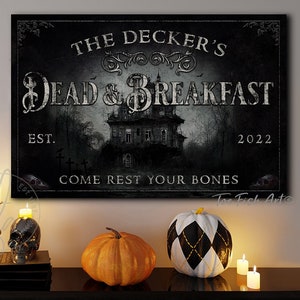 May include: A black and white sign with the text "The Decker's Dead & Breakfast Est. 2022 Come Rest Your Bones" and a spooky house in the background.