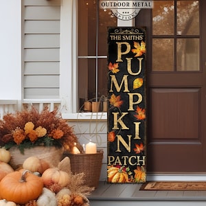 May include: A tall, rectangular vertical sign with a black background featuring the text THE SMITHS PUMPKIN PATCH in gold lettering. The design is decorated with colourful autumn leaves and pumpkin illustrations along the vertical text layout.