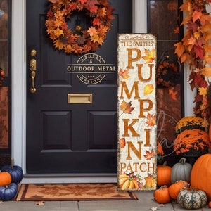 May include: A vertical wooden sign with the text "The Smiths Pumpkin Patch" in a vintage style font. The sign is decorated with fall leaves and pumpkins.