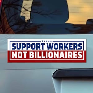 May include: A rectangular bumper sticker with the text "SUPPORT WORKERS NOT BILLIONAIRES" in white letters on a blue and red background. The sticker is affixed to the rear of a vehicle.