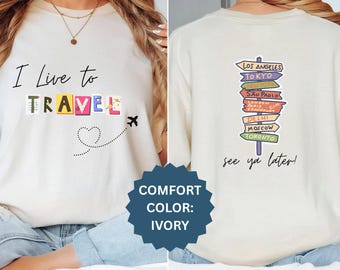 私は旅をするために生きている 心地よい色彩のTシャツ：世界の都市の道標