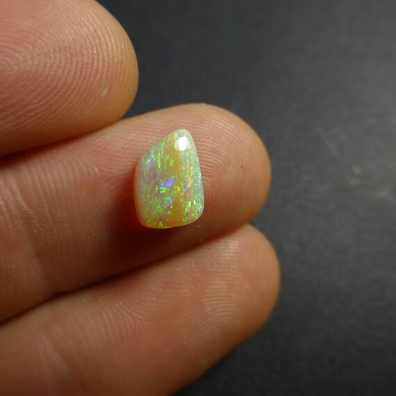 Natural Australian Boulder Opal freeform cabochon.....41x13x6mm....32CTS....B#2553