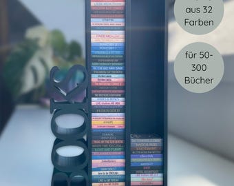 May include: A black bookshelf with the word "BOOKS" cut out on the side. The shelf is filled with colorful books. Text on the image says "Choose from 32 colors" and "for 50-300 books."