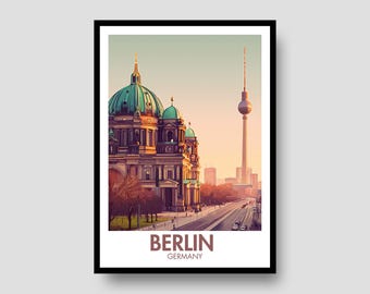 May include: A framed travel poster featuring a digital illustration of the Berlin Cathedral with its green dome and the Berlin TV Tower in the background. The scene is set at sunset with warm light. The text BERLIN GERMANY is printed at the bottom.