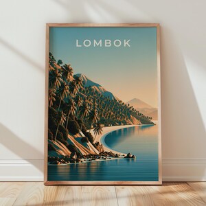 May include: A framed travel poster featuring a coastal landscape with the word LOMBOK printed at the top. The scene depicts a sandy beach, blue water, and a hillside covered in palm trees under a clear sky, all enclosed in a light wood frame.