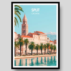 May include: A framed travel poster featuring a stylised illustration of the Split, Croatia waterfront. The image displays a tall bell tower, light-coloured buildings with orange roofs, and palm trees along the shore, reflected in blue water.