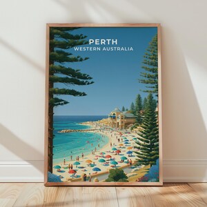 May include: A framed travel poster featuring a coastal scene in Perth, Western Australia. The artwork depicts a sandy beach with numerous colorful umbrellas, tall pine trees, a blue ocean, and a large building, with the text PERTH WESTERN AUSTRALIA.