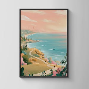 May include: A framed vertical wall art print depicting a coastal landscape with a winding path along grassy cliffs, turquoise ocean waves, and a soft pink sky. The scene features stylized trees, shrubs, and small figures walking along the trail.
