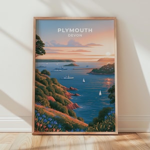 May include: A framed vertical art print featuring a coastal landscape of Plymouth, Devon. The illustration depicts a sunset over a blue harbor with several boats, rocky cliffs covered in green vegetation, and colorful wildflowers in the foreground.