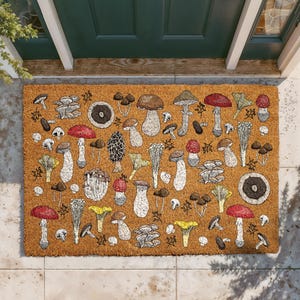 May include: A rectangular doormat with a brown background and a pattern of various mushrooms in shades of brown, red, yellow, and white. The mushrooms are illustrated in detail, creating a botanical theme. The mat is placed in front of a green door.