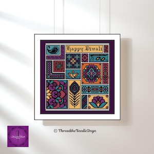May include: A framed cross-stitch artwork with a patchwork design in shades of purple, teal, orange, and yellow. The artwork features various geometric and floral patterns, with the text "Happy Diwali" at the top. A peacock feather is also visible.
