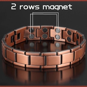 May include: A copper-colored magnetic bracelet with a rectangular link design. The bracelet features two rows of magnets, as indicated by the text "2 rows magnet" in white. The bracelet is displayed on a reflective surface.