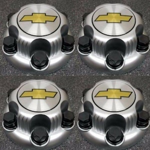 May include: Set of four silver and gold wheel center caps with a Chevrolet logo.