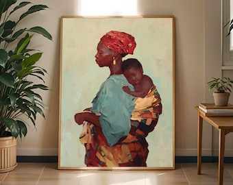 May include: A framed wall art print depicting a person with dark skin wearing a red headwrap and a teal shirt, carrying a small child on their back wrapped in a patterned fabric with shades of yellow, brown, and red against a pale background.