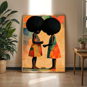 May include: A rectangular wall art print featuring two figures with large afro hairstyles standing in profile, facing each other. They wear sleeveless dresses with a vibrant, multi-colored dotted pattern in shades of orange, red, teal, and yellow against a warm, textured golden background.