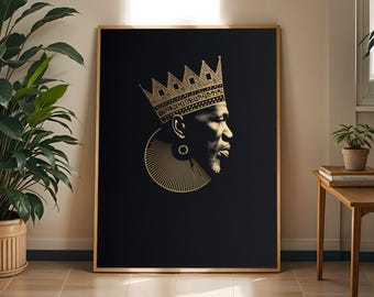 May include: A rectangular wall art print featuring a black background with a gold-toned profile illustration of a person wearing a crown and a large circular neck ornament. The artwork is encased in a thin gold frame and displayed on a wall.