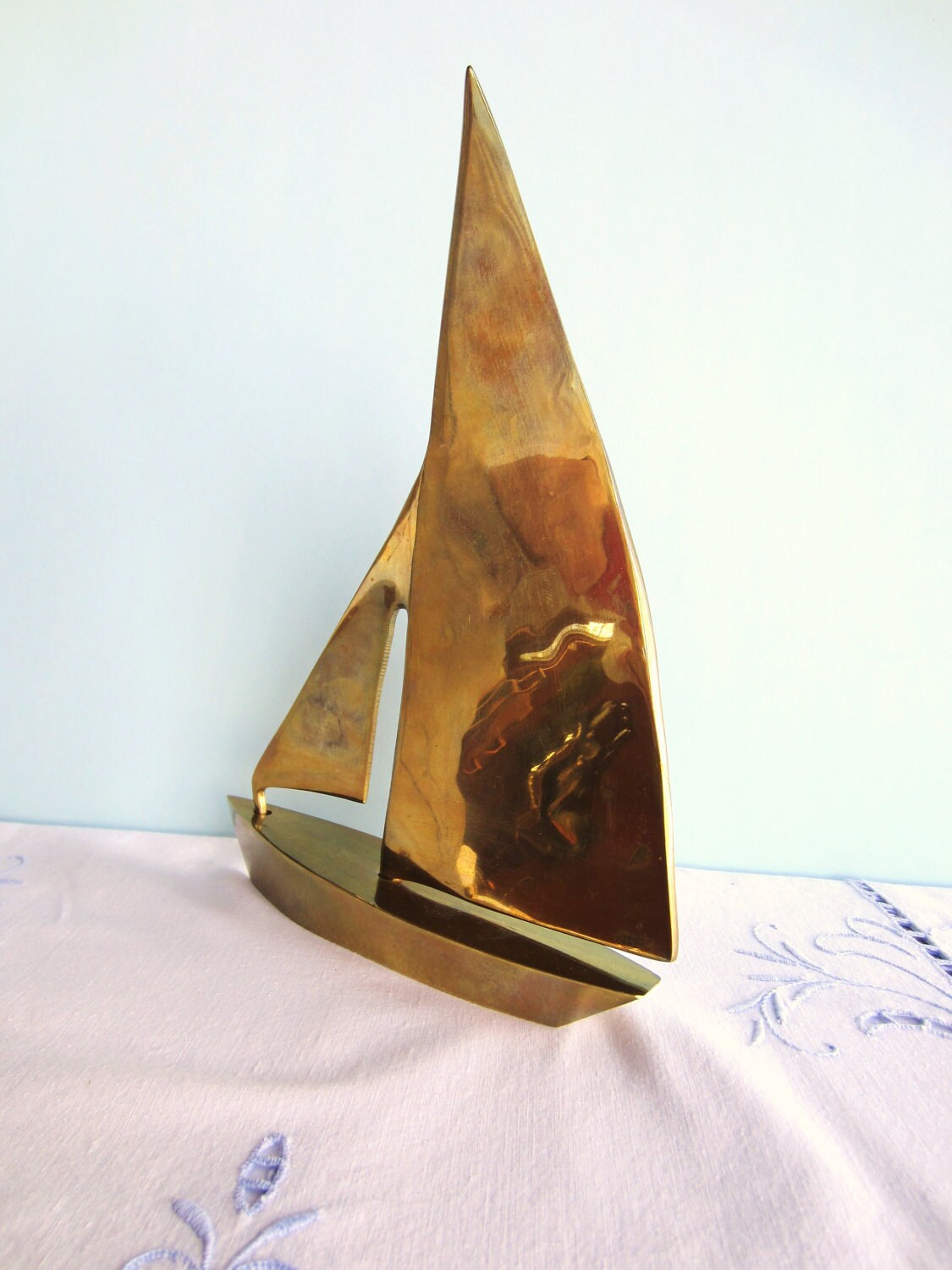 vintage brass sailboat