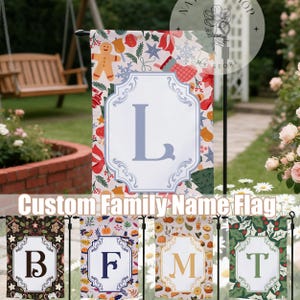 May include: A garden flag featuring a white frame with the letter "L". The flag has a festive pattern with gingerbread men, bows, and snowflakes. The text "Custom Family Name Flag" is displayed at the bottom of the flag.