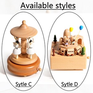 May include: Wooden music boxes with two distinct styles. One features ballerina figures under a wooden canopy, and the other showcases teddy bears with balloons and a train set. The text "Available styles" and "Sytle C" and "Sytle D" are visible.