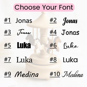 May include: A wooden carousel music box with several font options for personalization. The text "Choose Your Font" is at the top. Names like Jonas, Luka, and Medina are displayed in various fonts, numbered 1 through 10.