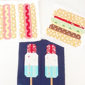 May include: A set of fabric squares featuring various summer food designs. The squares are made of different patterned fabrics and include a hot dog, hamburger, and popsicles.