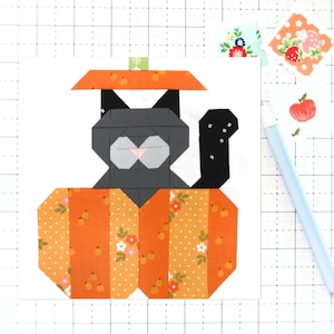 May include: A black cat wearing a pumpkin hat sits inside a pumpkin. The pumpkin is orange with white polka dots and floral patterns.