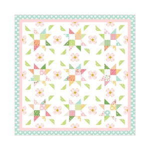 May include: A patchwork quilt with a white background, featuring star and flower patterns in shades of pink, green, yellow, and orange. The quilt has a pink border and a light green dotted edge. The quilt is square.
