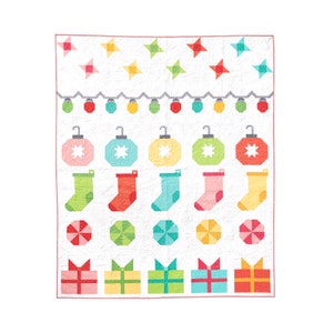 May include: A white quilt block with a Christmas theme. It features a row of colorful ornaments, stockings, presents, and stars. The background is white with a subtle texture.