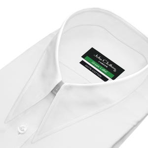 May include: A crisp white dress shirt with a classic collar and buttoned cuffs. The shirt features a label that reads "John Clothier LONDON Green Label 100% Cotton."