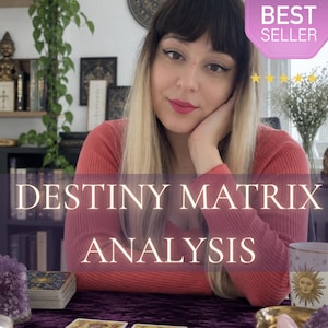 May include: A person with blonde and dark hair wearing a coral long-sleeved shirt sits behind a purple cloth with tarot cards, a crystal, and a mug. The text reads DESTINY MATRIX ANALYSIS with a BEST SELLER badge and five yellow stars above.