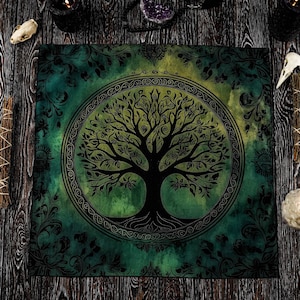 May include: A square tapestry featuring a Tree of Life design within a Celtic knot border, set against a green and yellow watercolour background. The tapestry is surrounded by candles, crystals, and other spiritual items on a dark wooden surface.