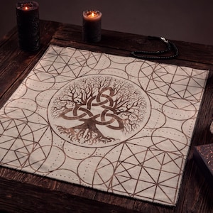 May include: A square fabric altar cloth featuring a central copper-coloured tree of life design intertwined with a triquetra knot. The surrounding pattern consists of geometric circles and intersecting lines printed in a metallic copper finish.