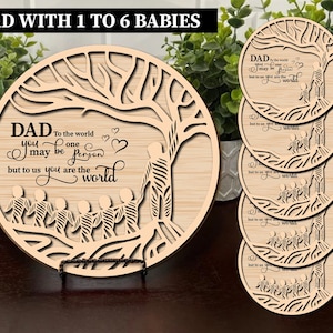 May include: A set of six wooden coasters featuring a tree design and the text "To the world you may be one person but to us you are the world". The coasters are designed for a dad with 1 to 6 babies.