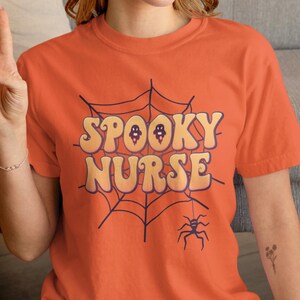Spooky Nurse Shirt, Unisex Halloween Nurse Tee, Funny Ghost Medical T-Shirt, Cute Fall Top for Night Shift or Clinic Crew, Nurse Gift Idea