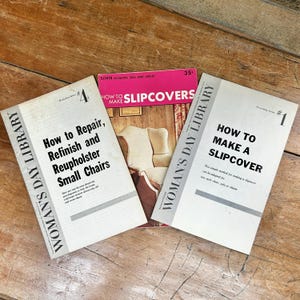May include: Three vintage Woman's Day Library instructional booklets. The left booklet is Workshop Series #4, How to Repair, Refinish and Reupholster Small Chairs. The center is How to Make Slipcovers. The right is Decorating Series #1, How to Make a Slipcover.