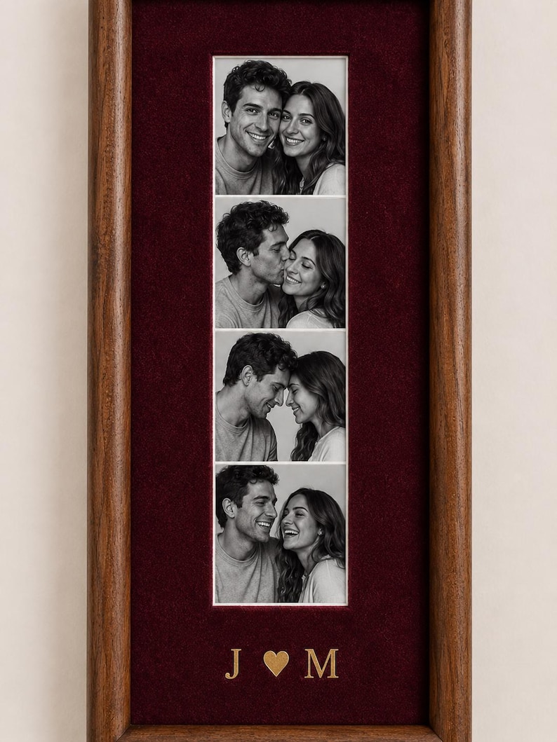 May include: A vertical wooden picture frame with a deep red velvet mat containing four black and white photographs of a couple in various poses. Below the photos, the gold-colored letters J and M are separated by a small gold heart symbol.