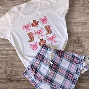 Womens super comfy short pyjama set featuring cowboy boots with a pink bow,  western pjs, cowgirl sleepwear.