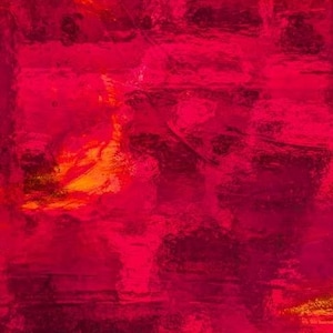 May include: A square, translucent sheet of red acrylic with a textured, uneven surface. The material displays varying shades of deep crimson and bright magenta, with subtle hints of orange light filtering through the semi-transparent plastic.