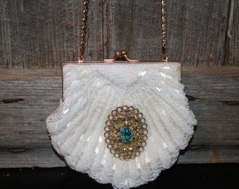 White beaded purse with pretty brooch and chain handle