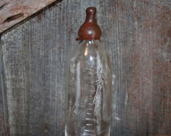 Antique vintage glass baby bottle See Saw Margery Daw