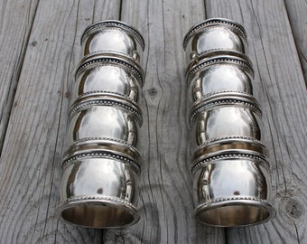 Set of 8 Godinger silver plate napkin rings