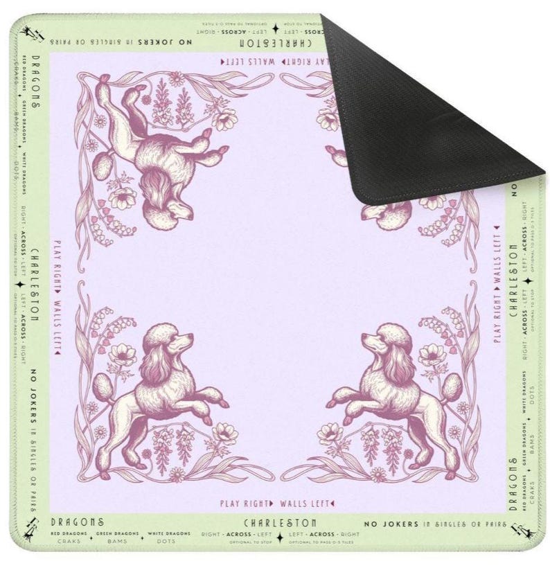 May include: A rectangular mousepad featuring a light purple background with a decorative border and four poodle illustrations. The border includes floral elements and text that reads "Charleston" and "Dragons".