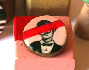a brooch with a gentleman. handmade from clay and paint