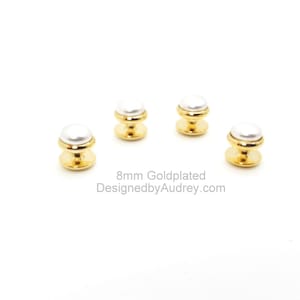 May include: Four gold-plated shirt buttons with white pearl-like tops. 8mm Goldplated DesignedbyAudrey.com