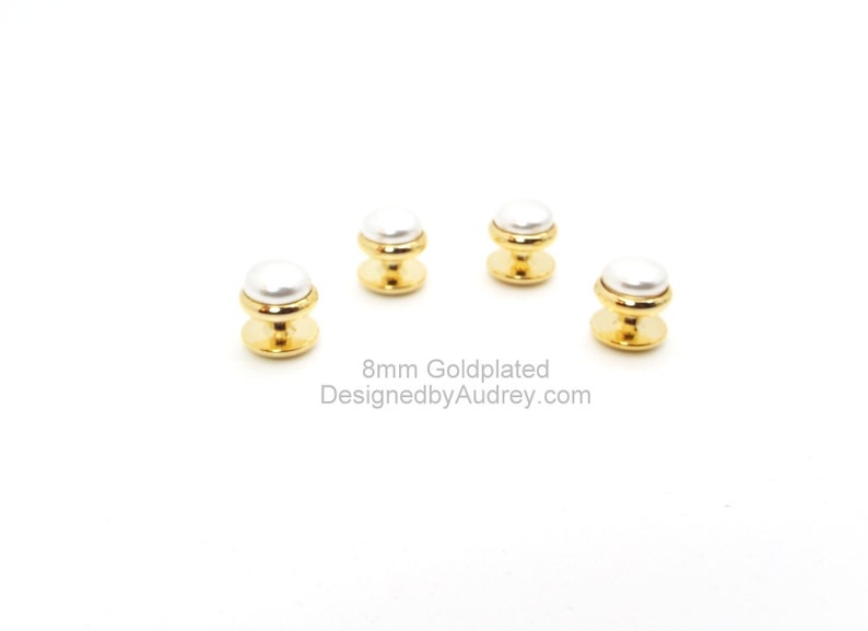 May include: Four gold-plated shirt buttons with white pearl-like tops. 8mm Goldplated DesignedbyAudrey.com