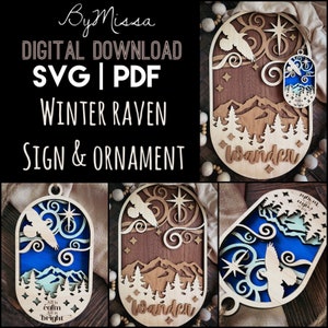 May include: A digital download SVG and PDF file for a winter raven sign and ornament. The design features a raven flying in a blue sky with stars and a mountain range in the background. The text "Wander" is written on the sign. The ornament has the text "All is calm, All is bright".